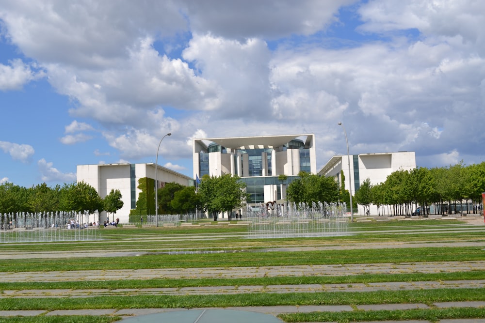 a large building with a fountain in front of it