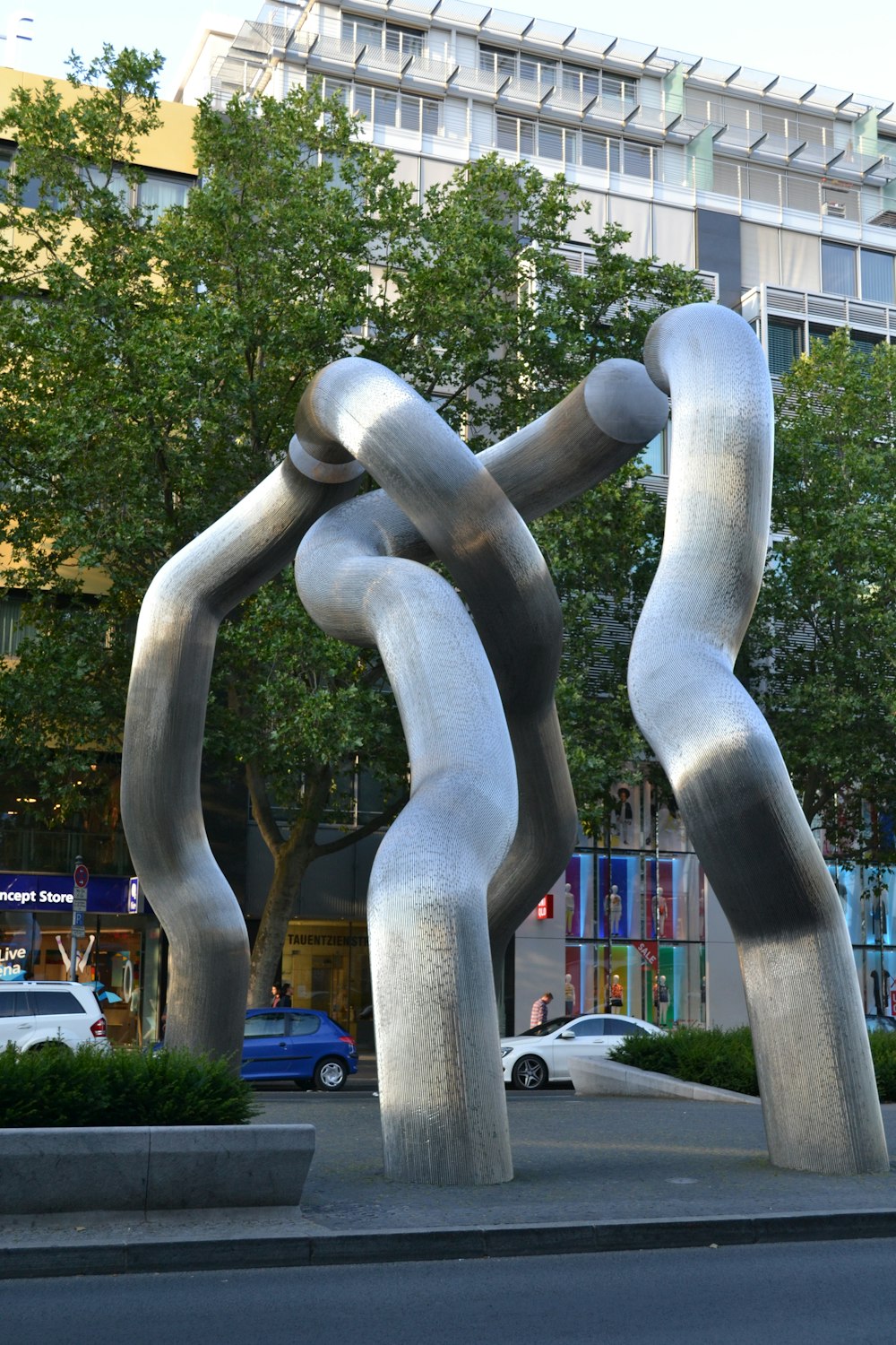 a large metal sculpture in the middle of a street