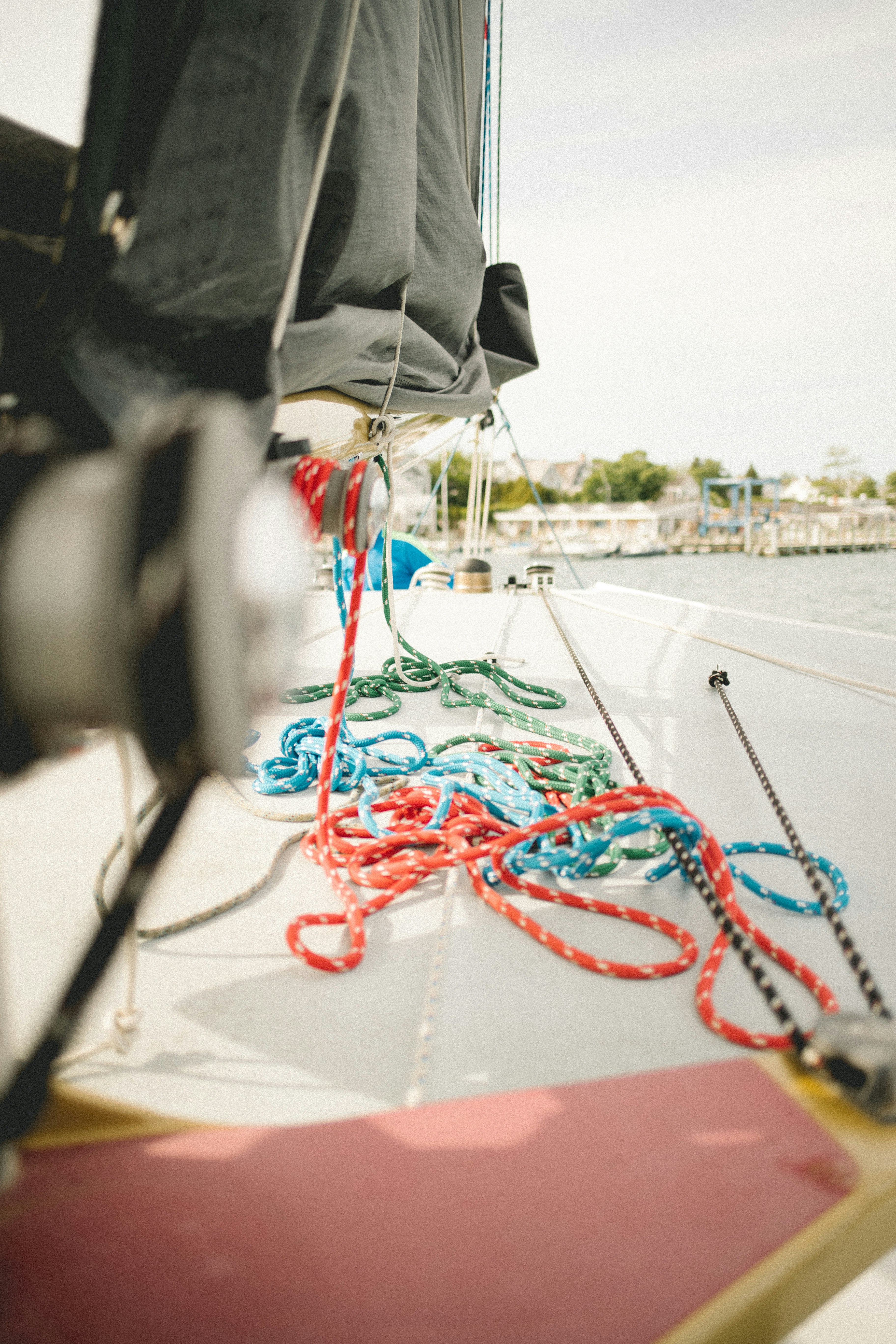 A close up of a boat's ropes on the water photo – Free Sailboat Image ...