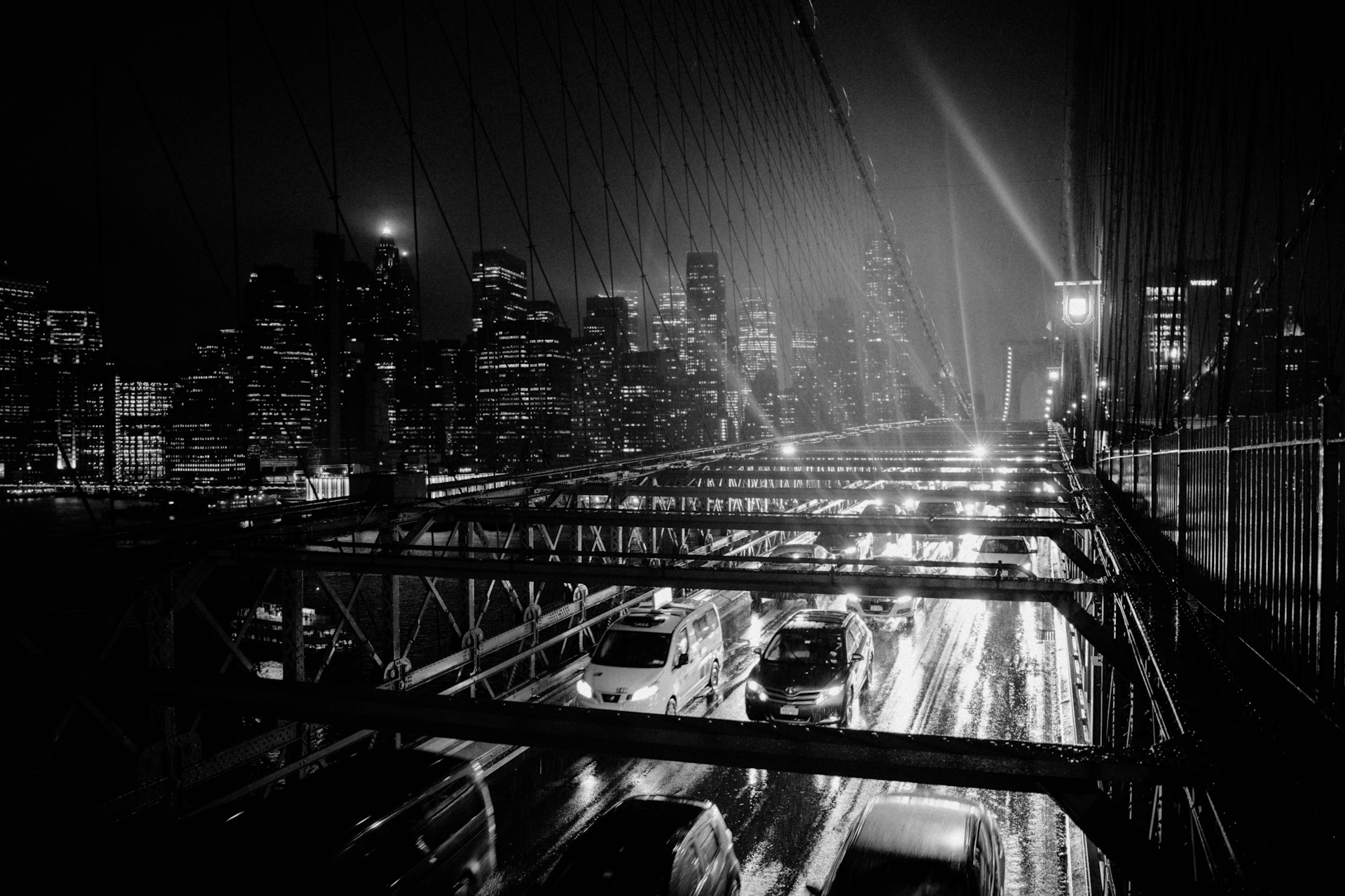 a black and white photo of a city at night