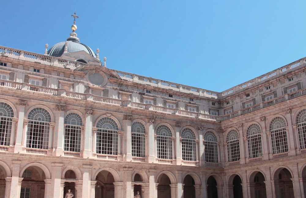 a large building with many windows and arches