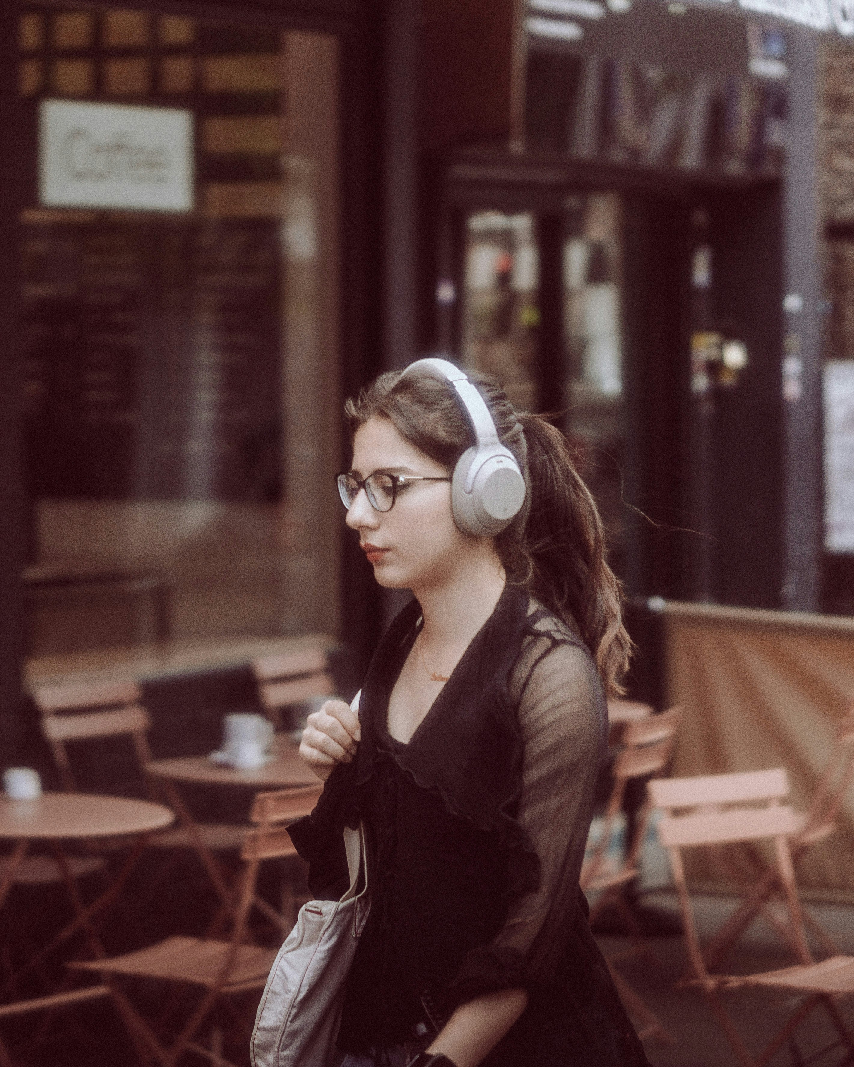 a woman standing in front of a building