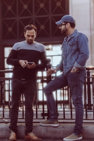 a couple of men standing next to each other