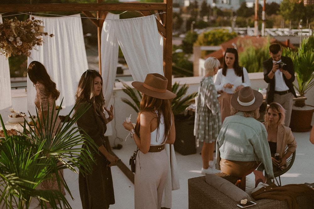 a group of people standing around each other