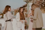 A group of diverse women enjoying a stylish outdoor gathering.