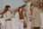 A stylish group of women enjoying a luxurious outdoor event with elegant decor and scenic views.