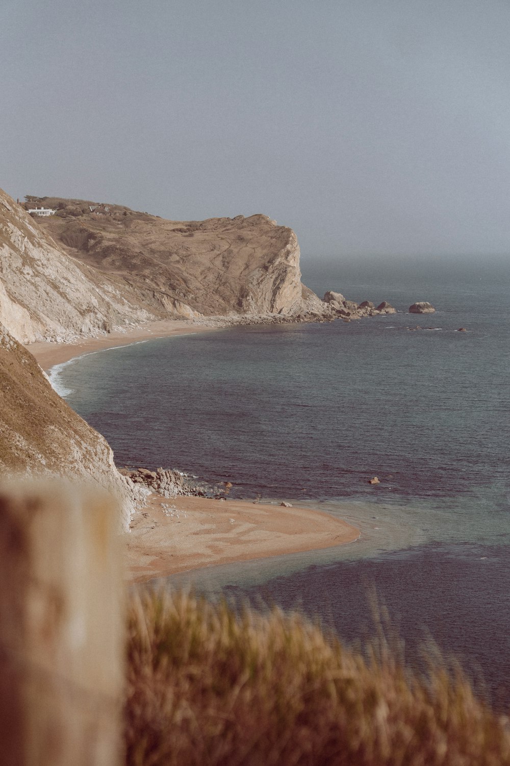 a body of water near a sandy beach