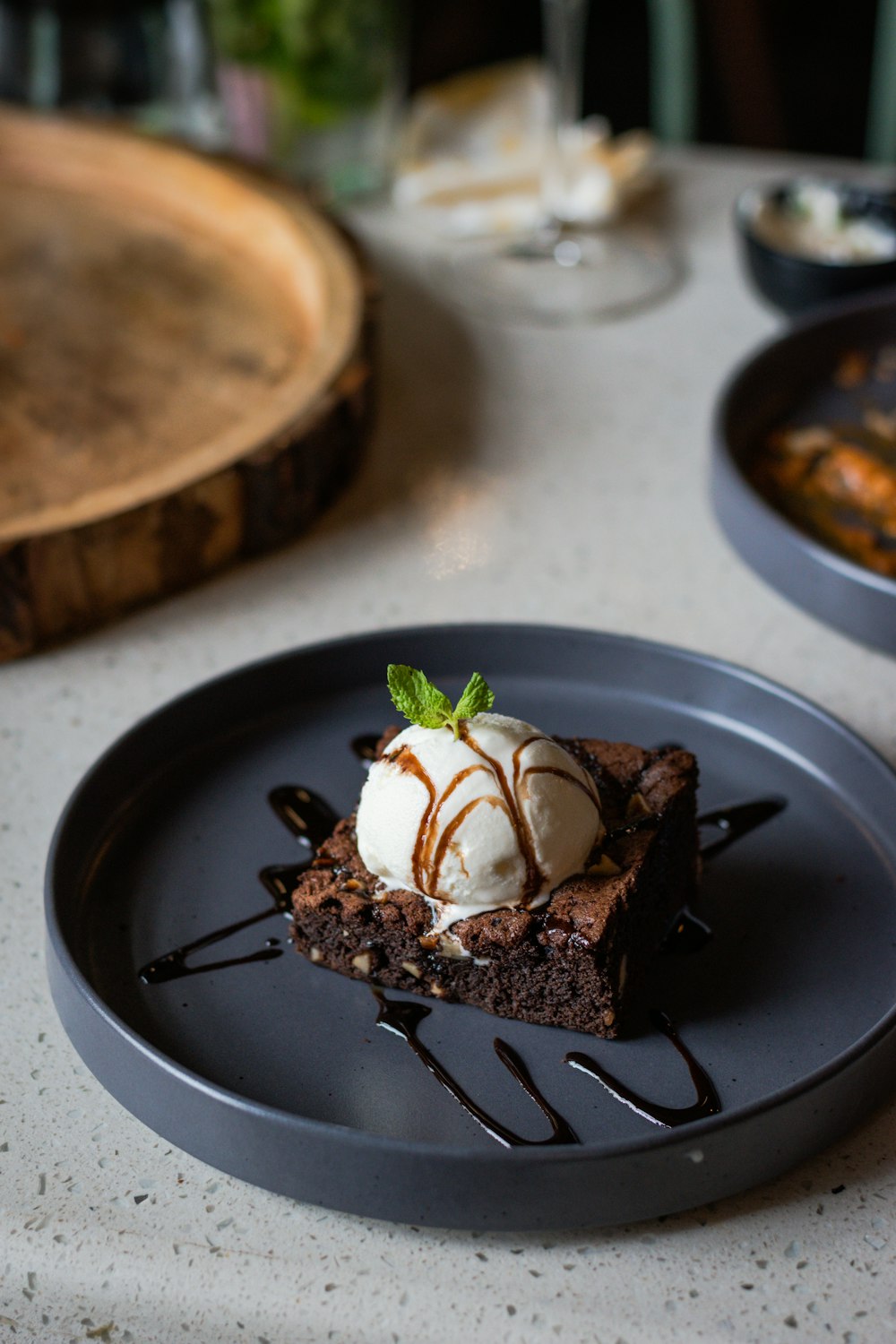 a piece of chocolate cake with ice cream on top