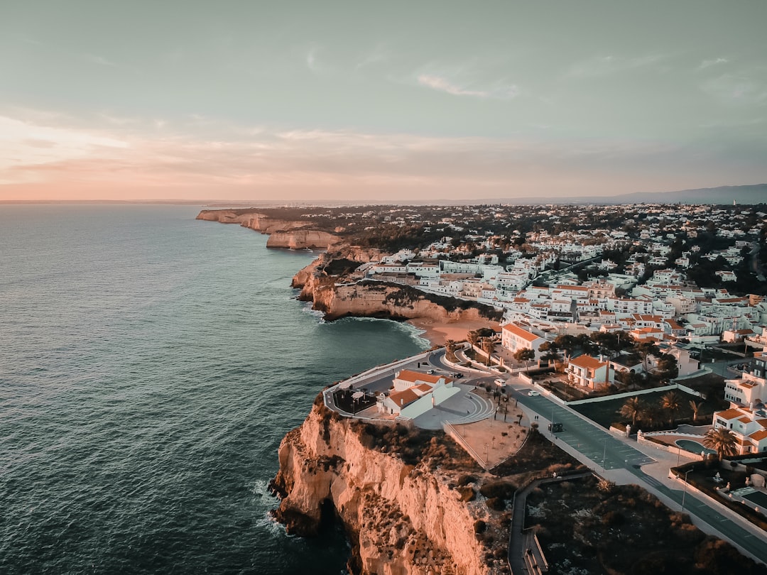 an aerial view of a city next to the ocean