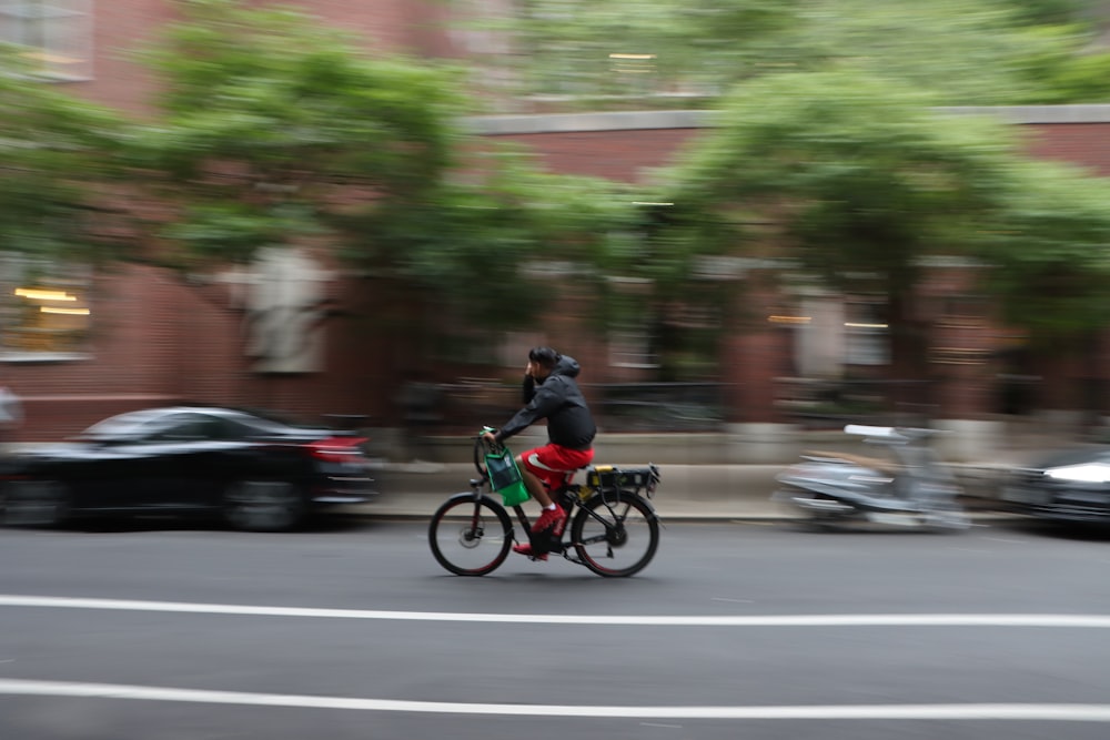 a person riding a bike on a city street