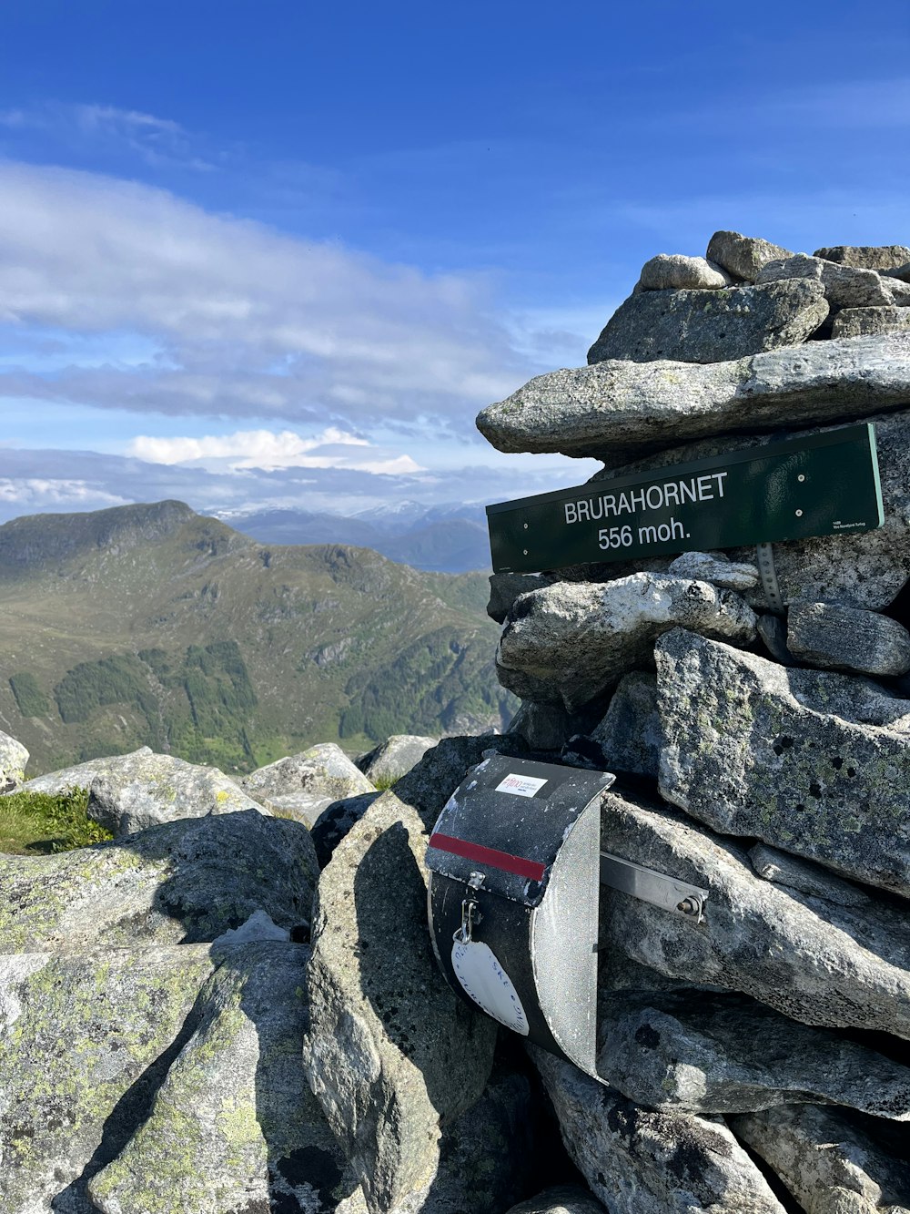 a backpack sitting on top of a pile of rocks