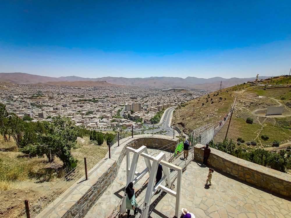 a group of people standing on top of a hill