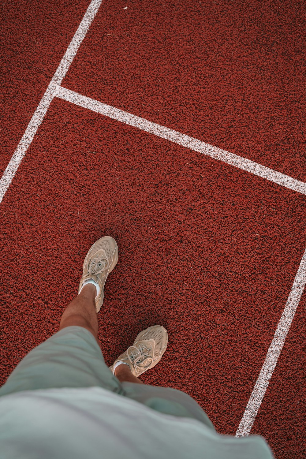 a person is standing on a tennis court