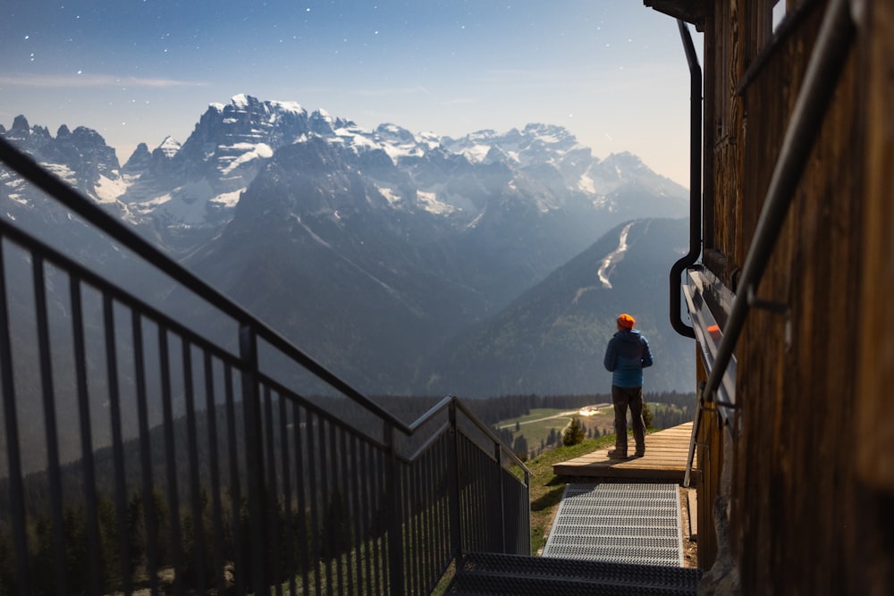 a person standing at the top of a set of stairs