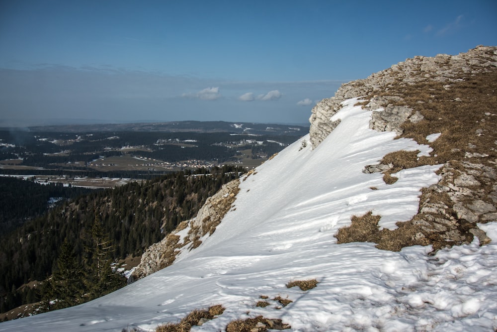 a person on a snowboard on a snowy mountain