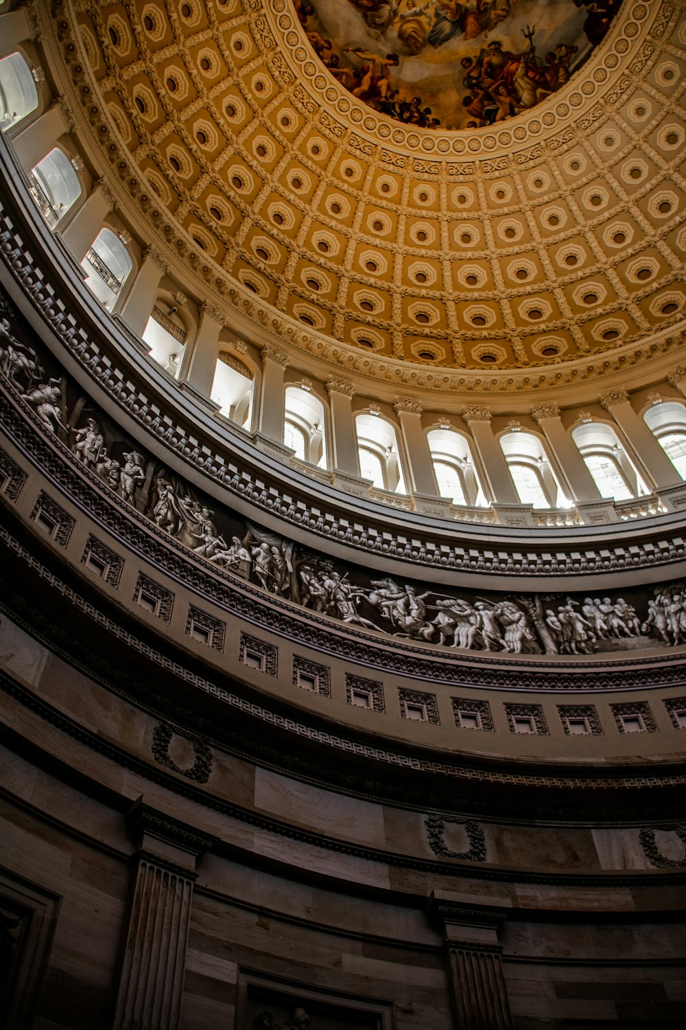 the dome of a building with a painting on the ceiling