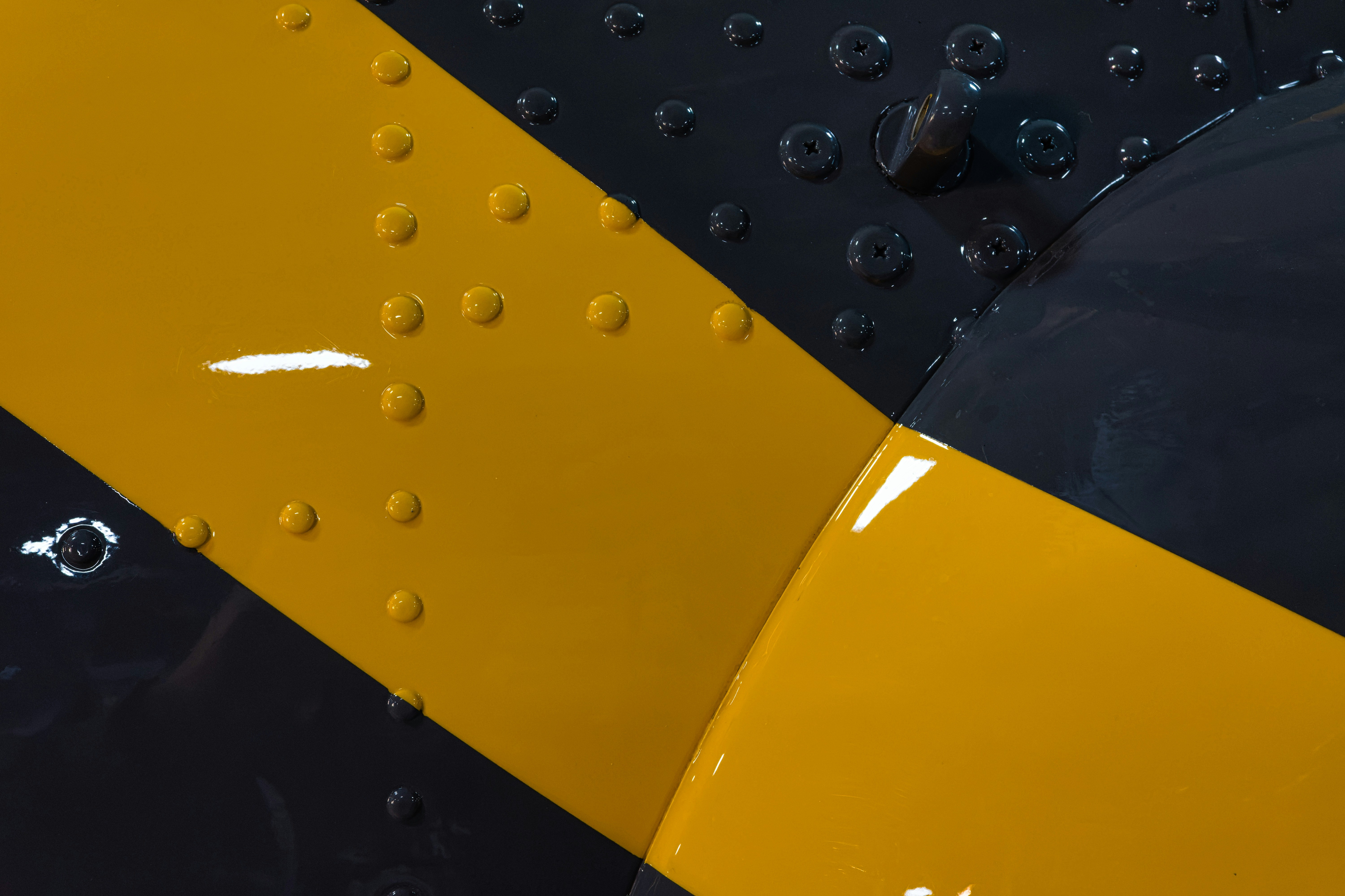 a close up of a yellow and black airplane