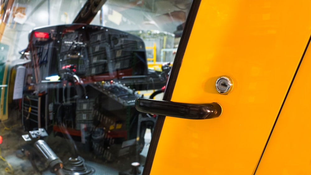 a close up of a door handle on a bus