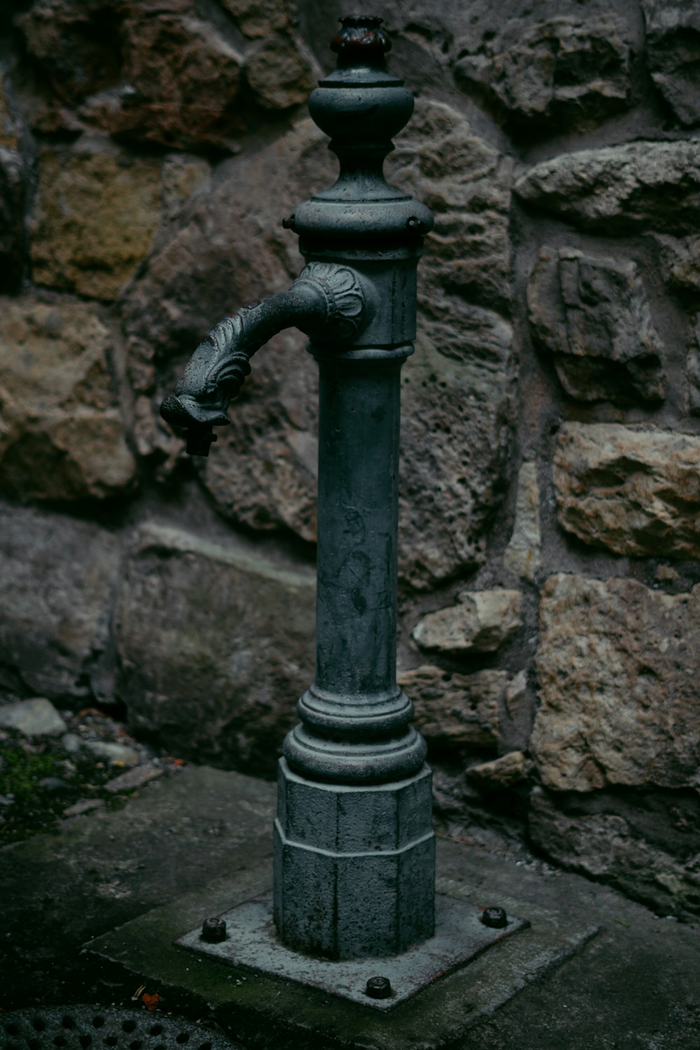 a metal pipe with a black handle