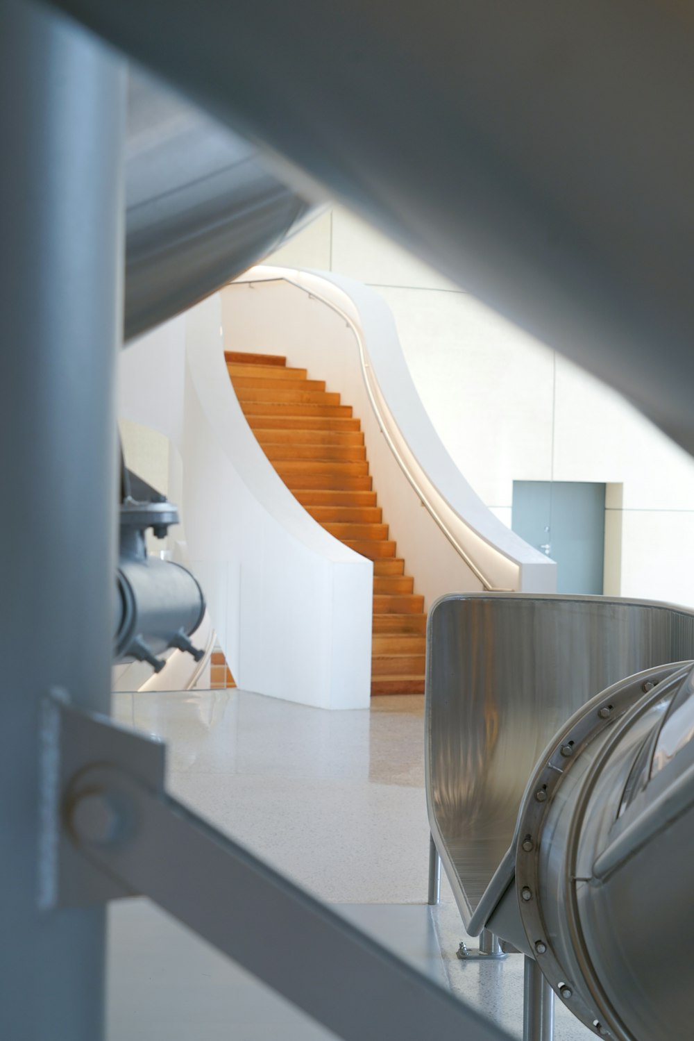 a kitchen with a wood staircase