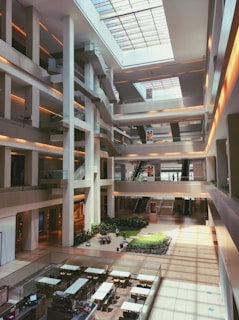 a building with a glass floor and plants