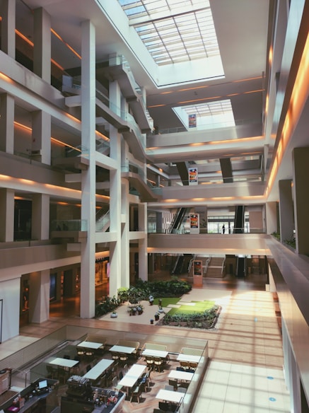 a building with a glass floor and plants