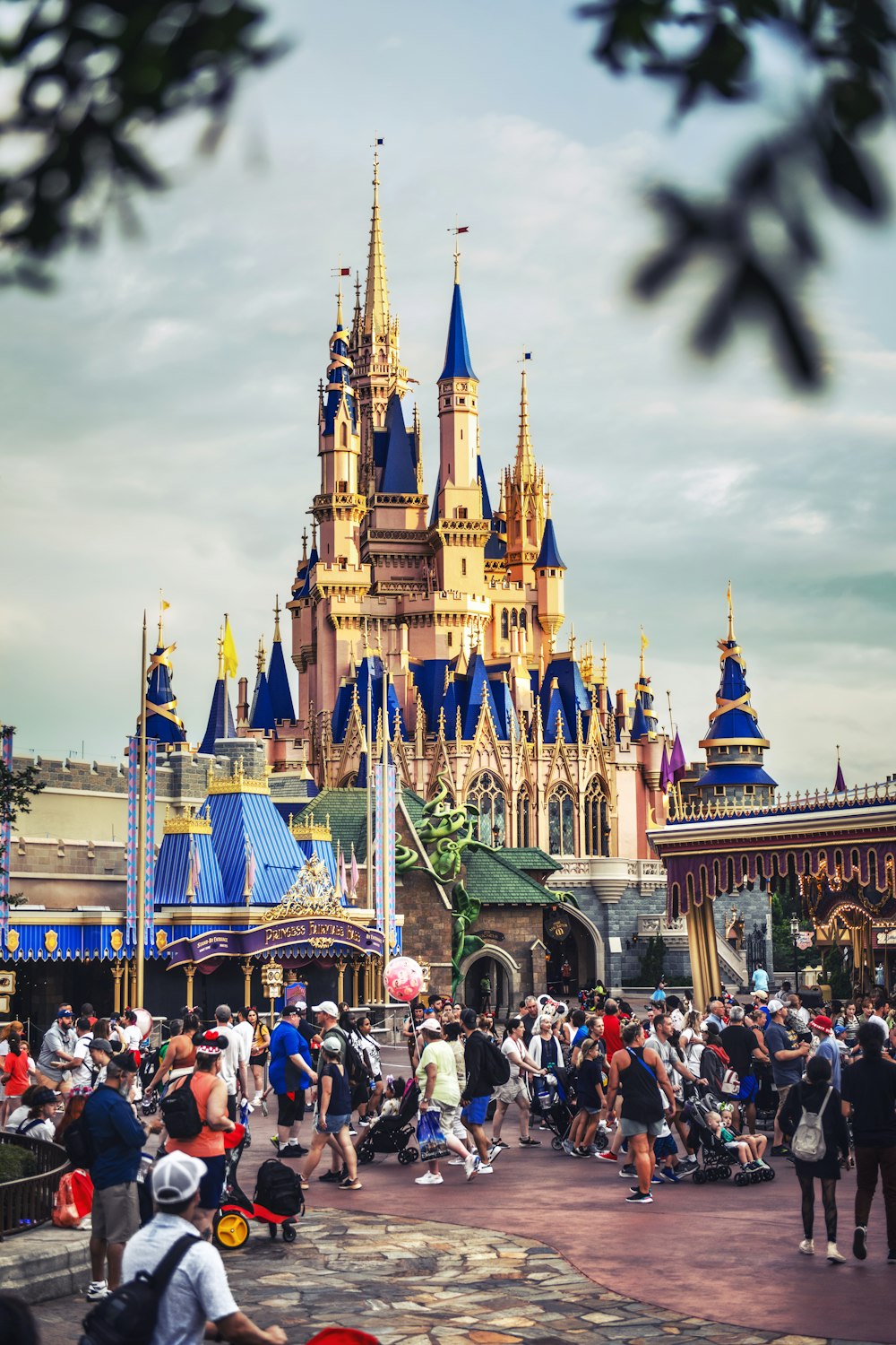 a castle with many people walking around