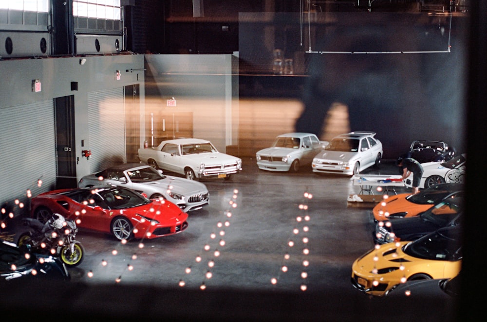 a group of cars parked in a garage