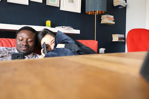 A cozy couple sharing a quiet moment on turulobe's sleek, violet-accented interface.