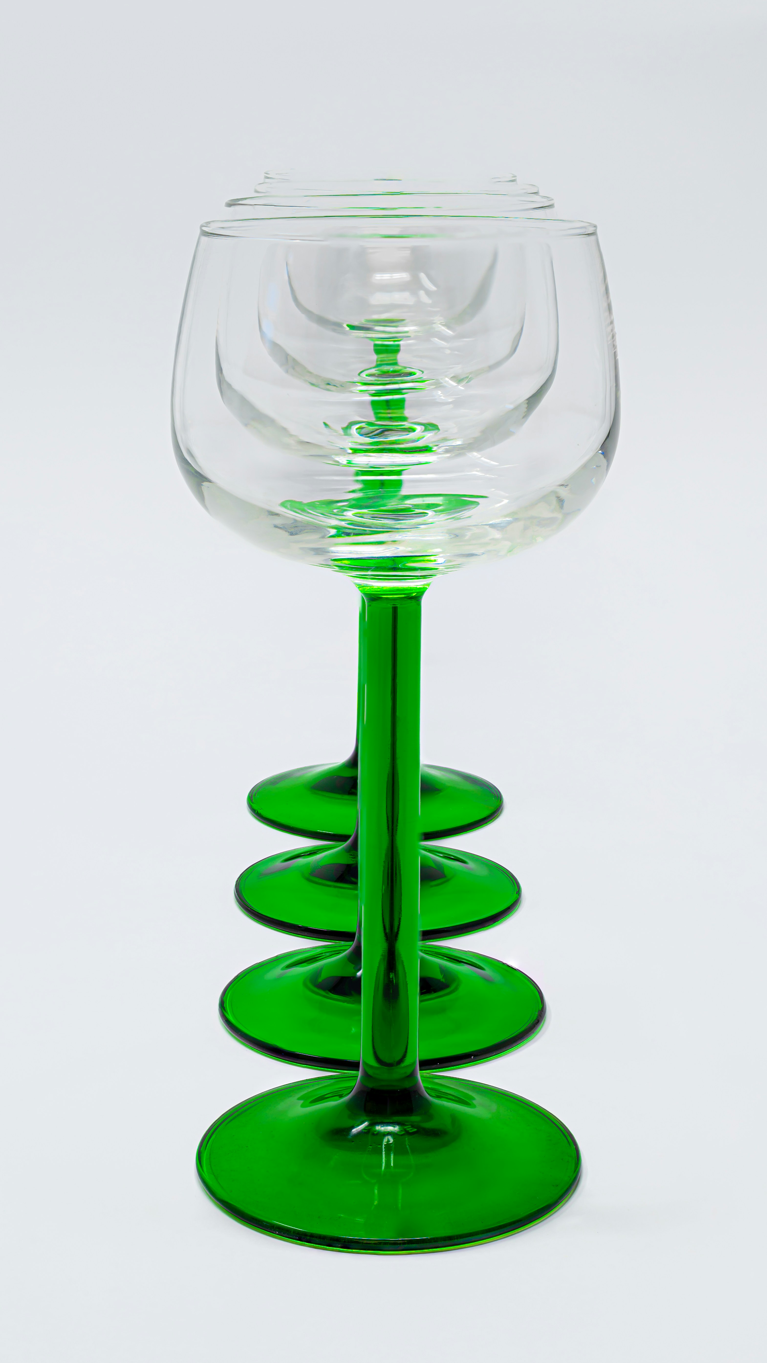 a glass with a green liquid in it