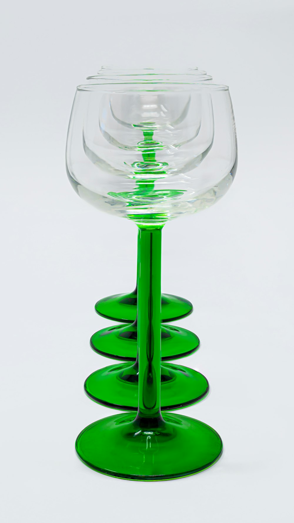 a glass with a green liquid in it