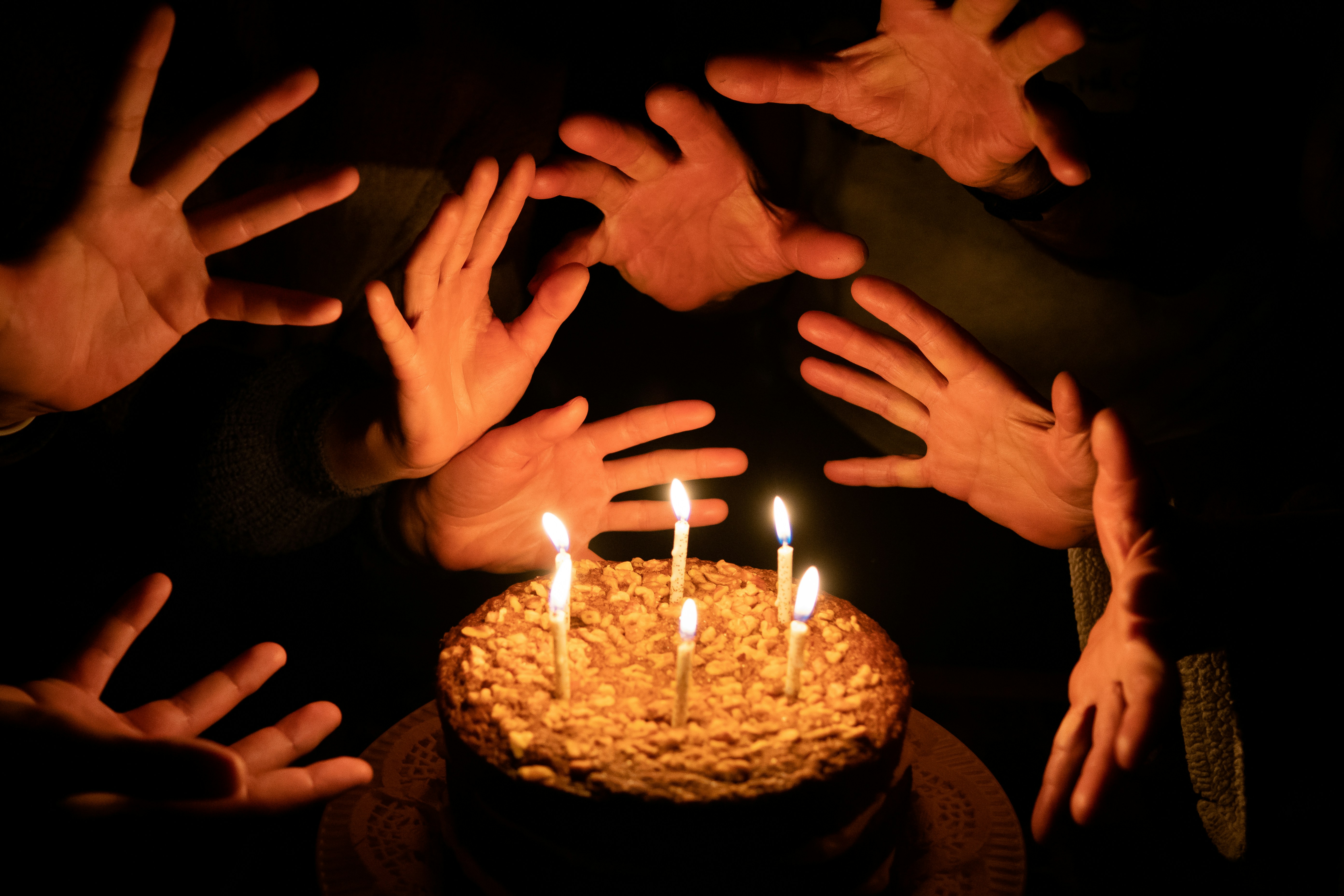Hands reaching for a cake with candles photo – Free Birthday cake Image ...