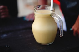 a glass with a drink in it