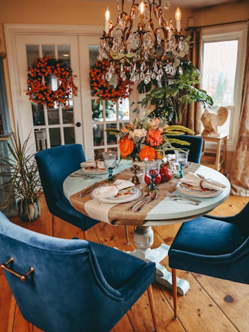 a dining table with plates and glasses