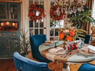a dining table with blue chairs
