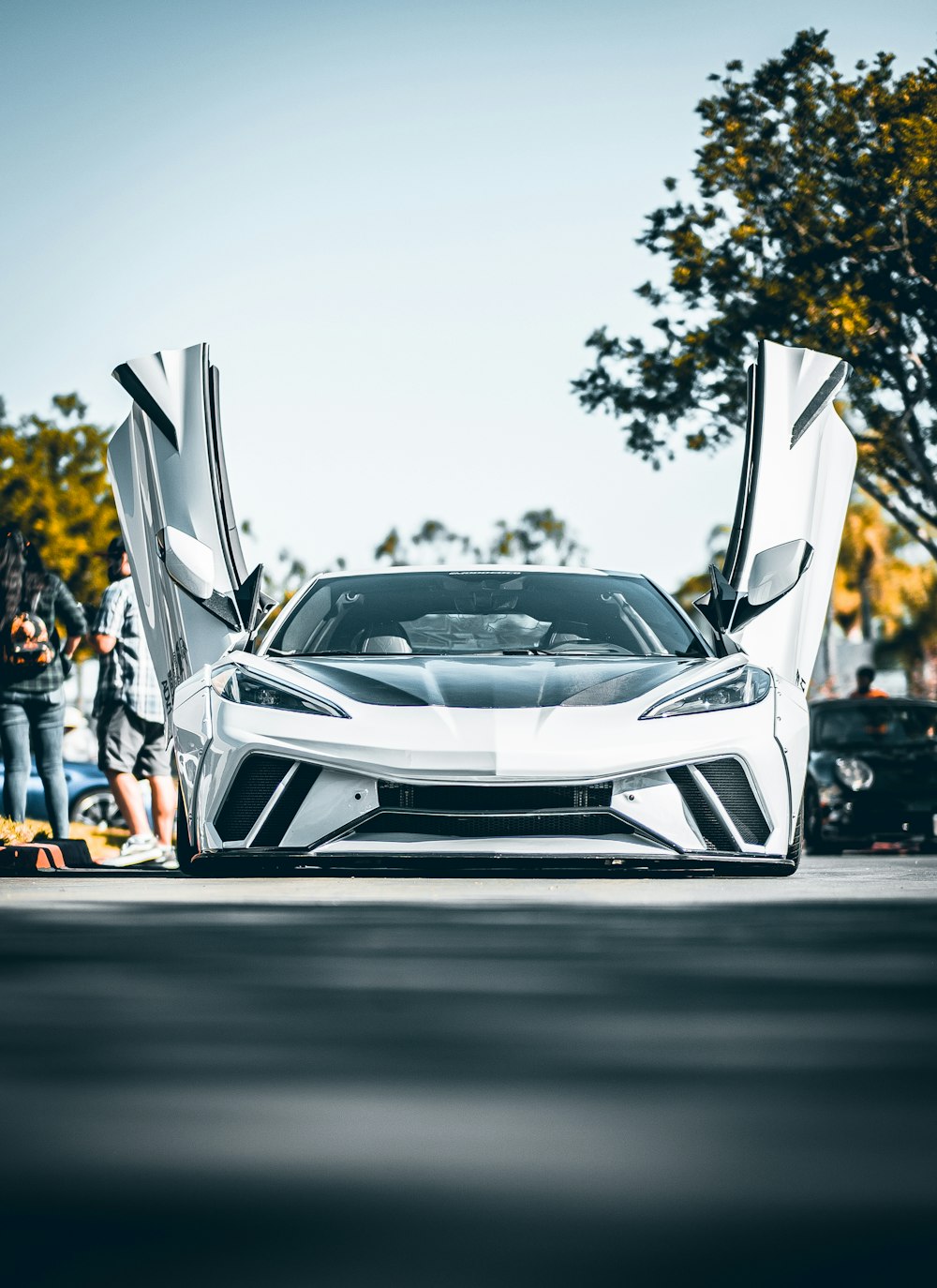 a white car with its doors open