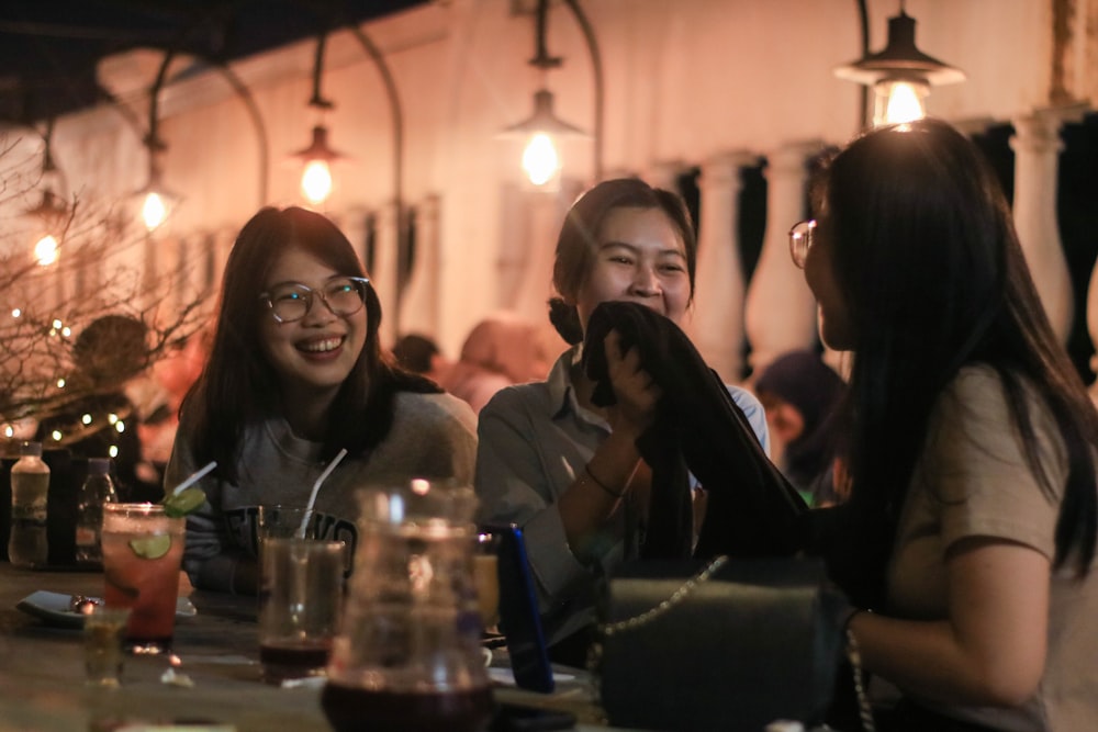 a group of women sitting at a table