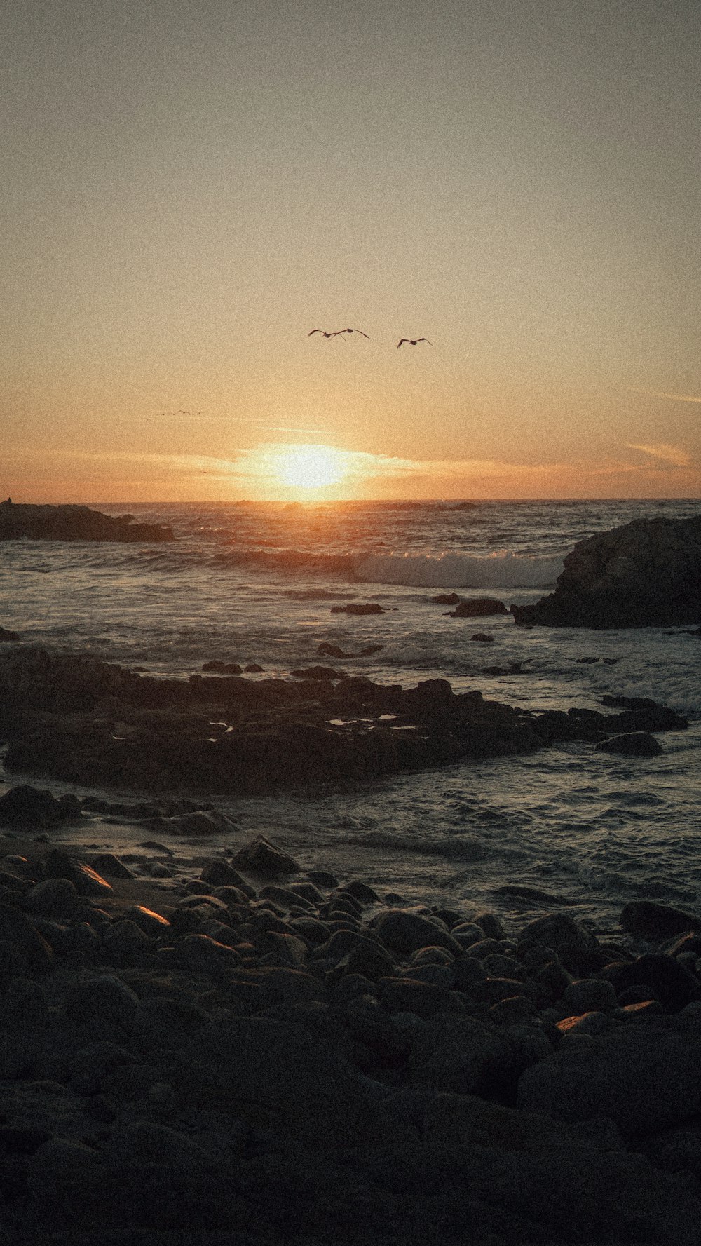 a sunset over a beach