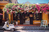 A vibrant storefront of varejovivo bustling with customers on a sunny day.