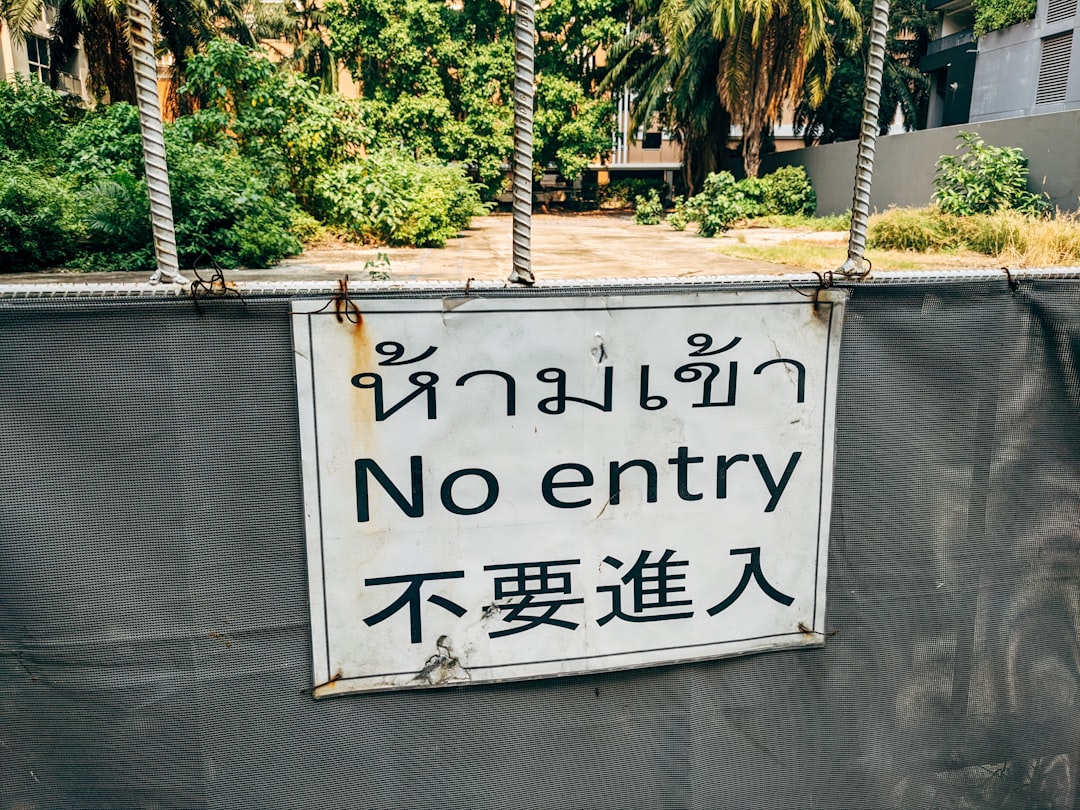 a sign on a fence,