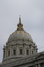 a domed building with a gold roof