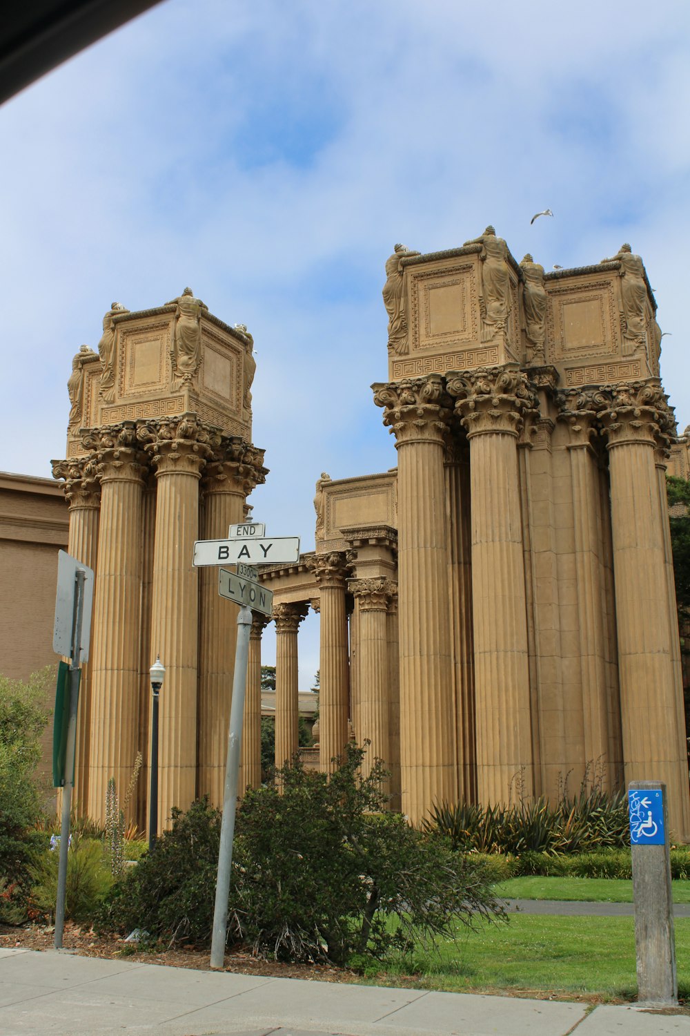 a building with columns and a sign