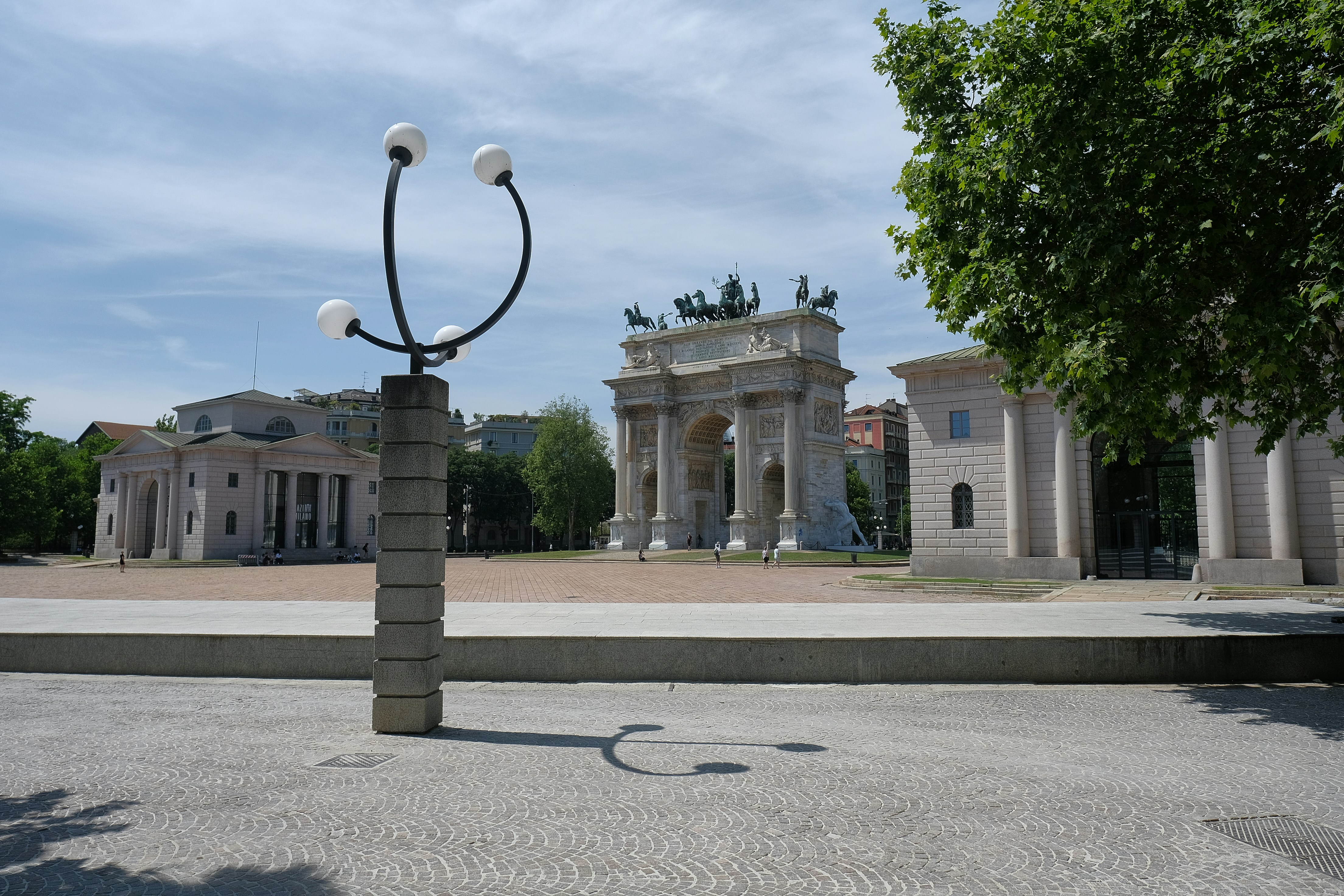 a large building with a statue in front of it
