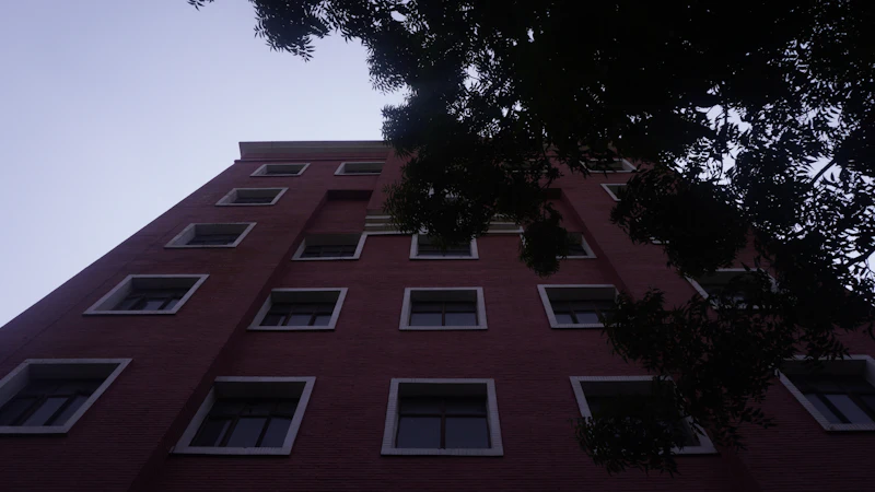Apartment building with trees behind it in New Delhi