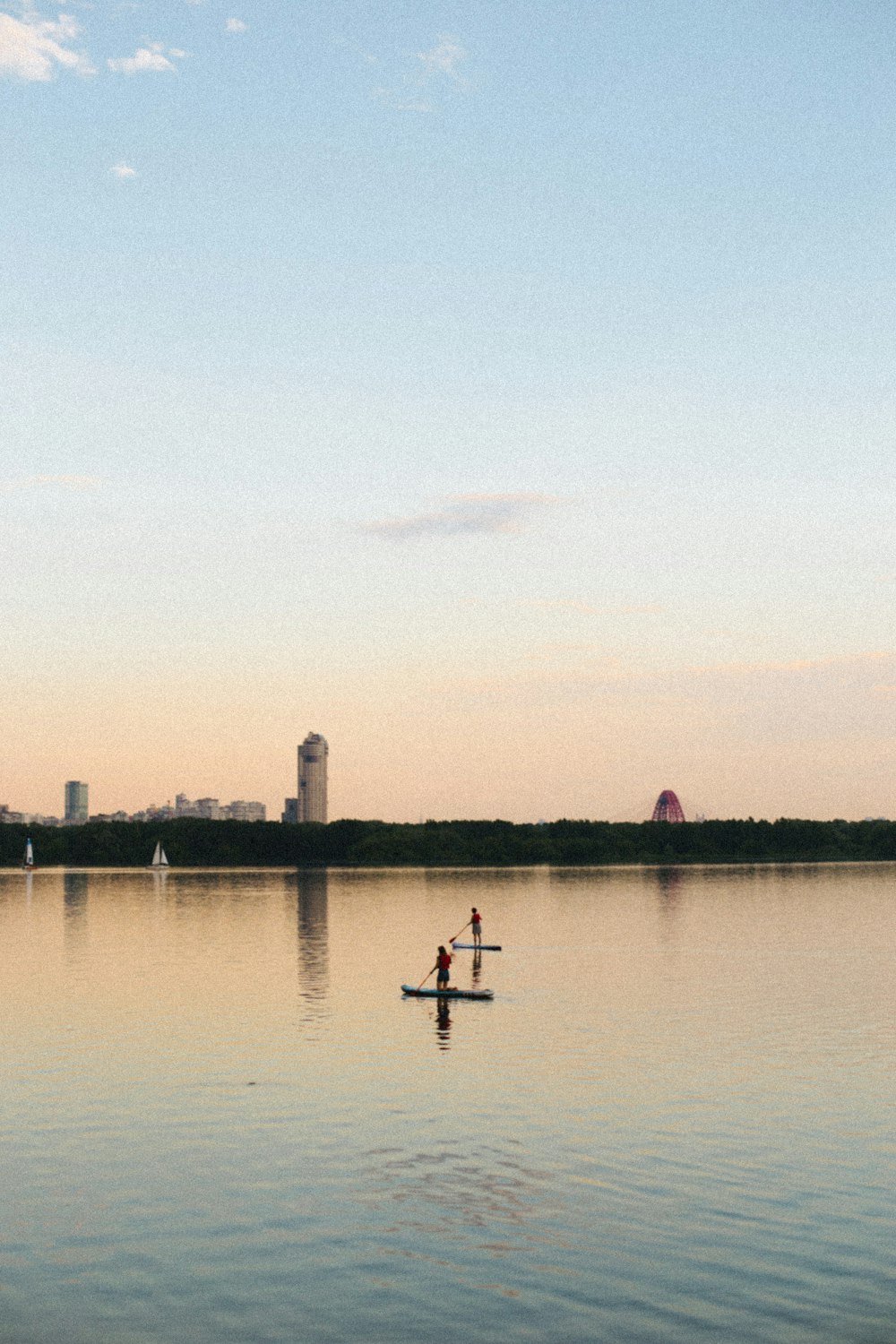 a couple of people on a boat in a body of water