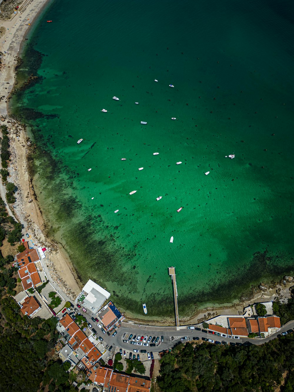 a beach with many boats