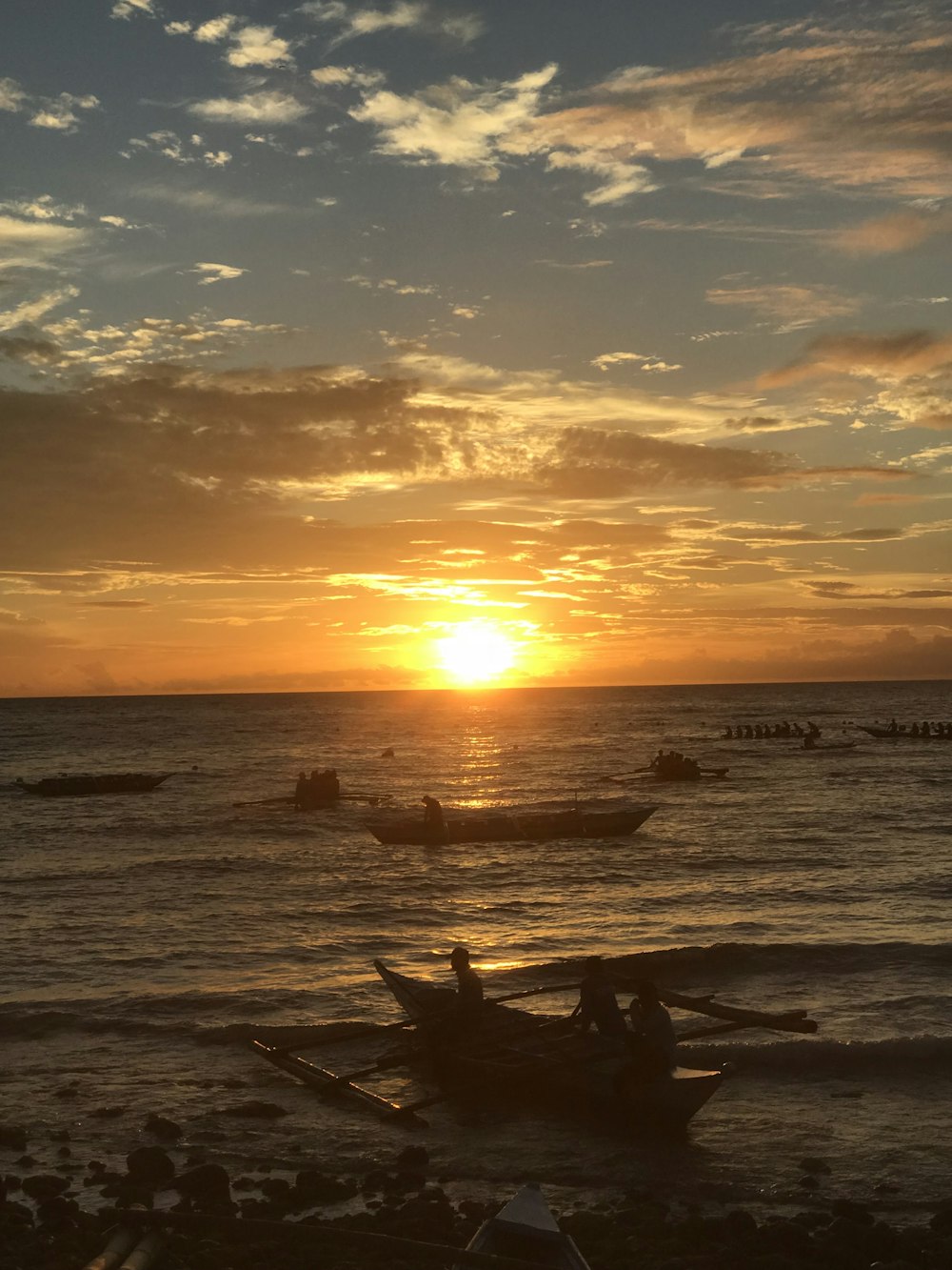 a sunset over a body of water