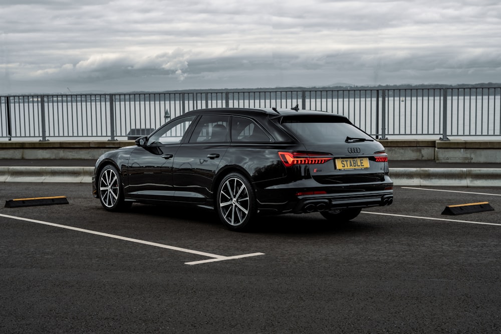 a black car parked on a road