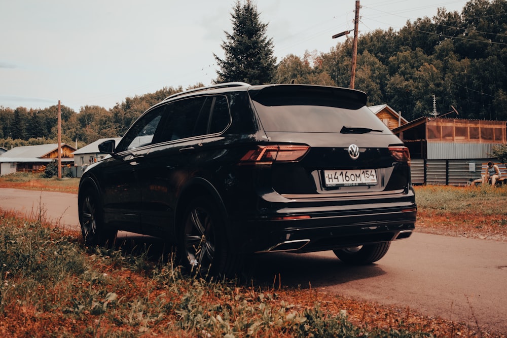 a black car parked on a road