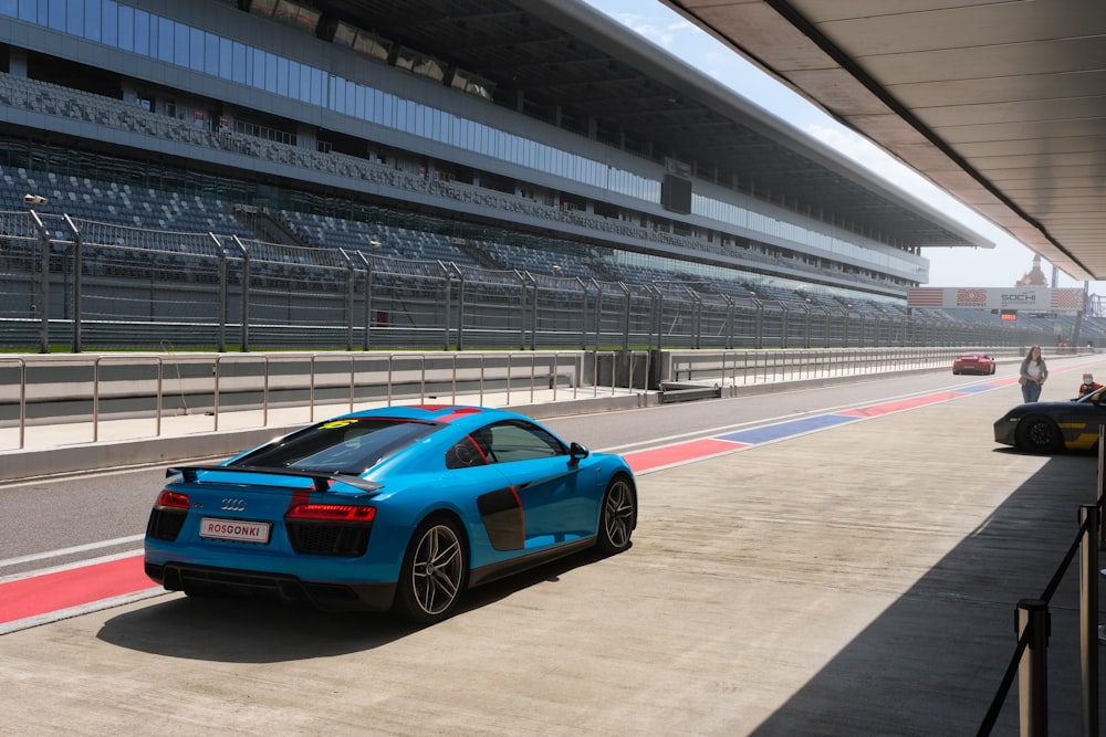 a blue car on a race track